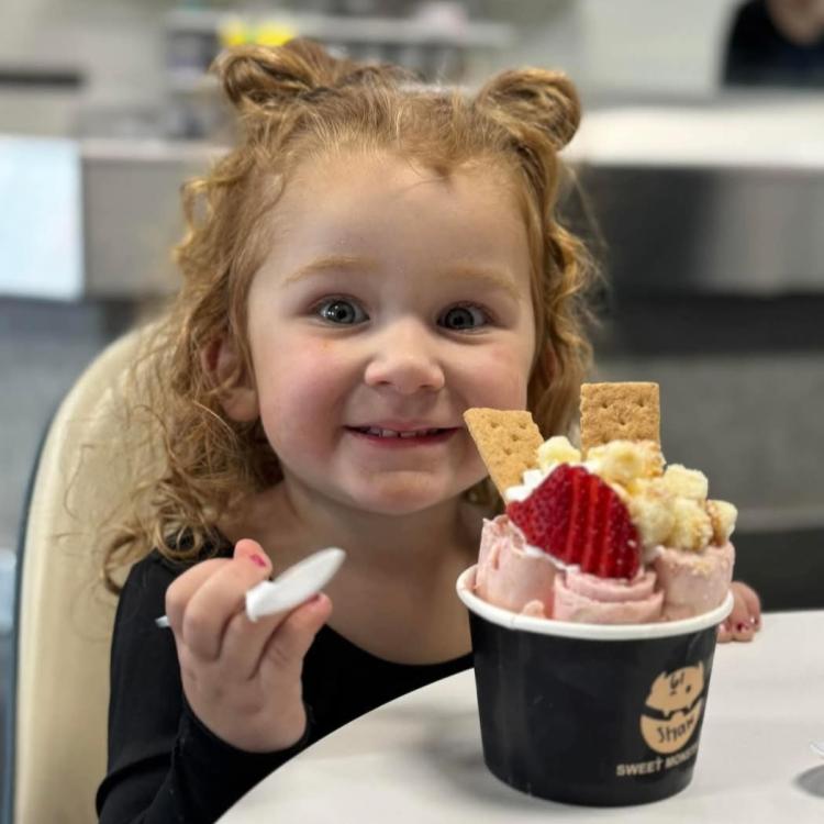 smiling little girl with ice cream 