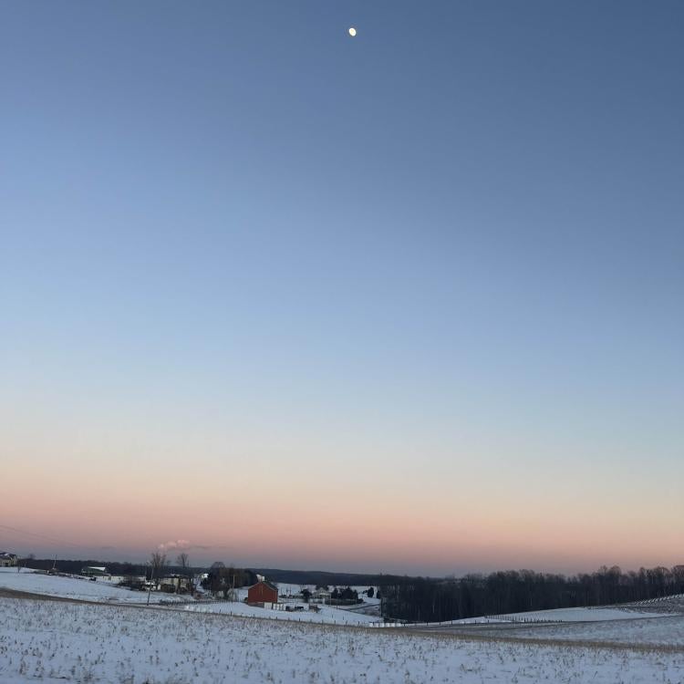 sunset over snowy fields
