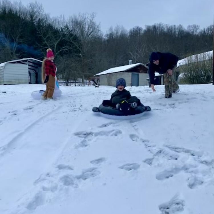 people sledding