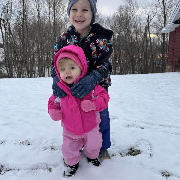two smiling children in snow