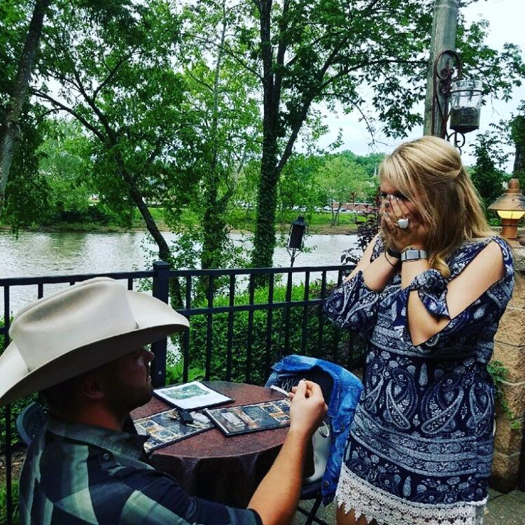 man knelt down in front of woman