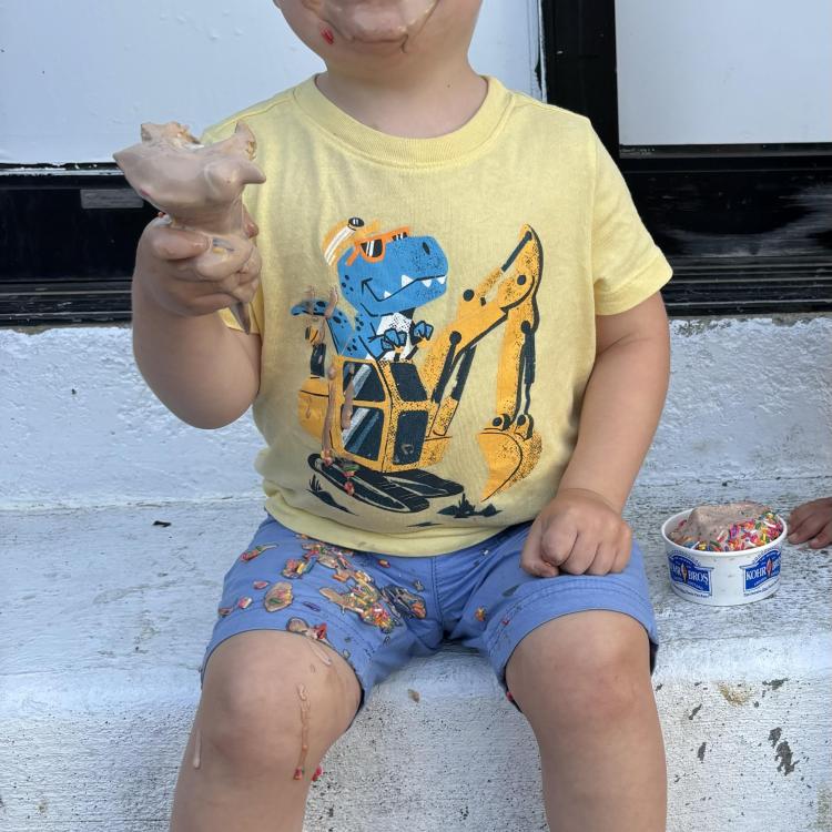 smiling little boy with ice cream cone
