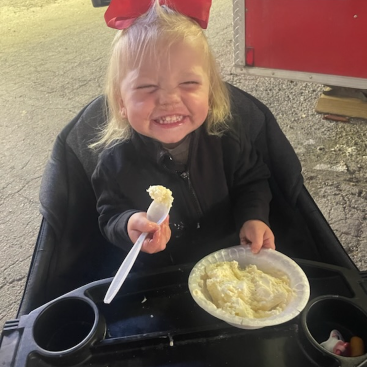 smiling girl with bowl of ice cream