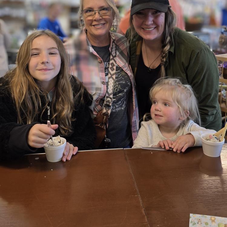 two women and two girls with ice cream