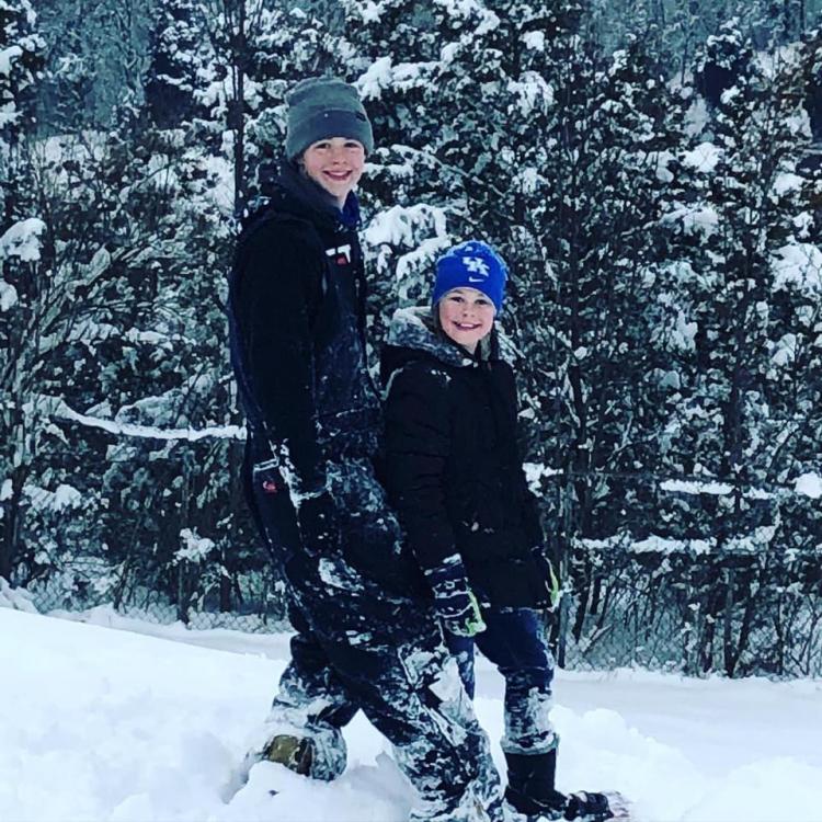 boy and girl walking in snow