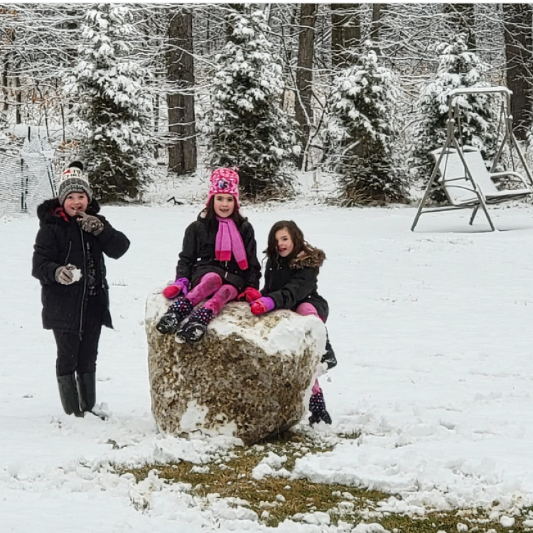 three kids with giant snowball
