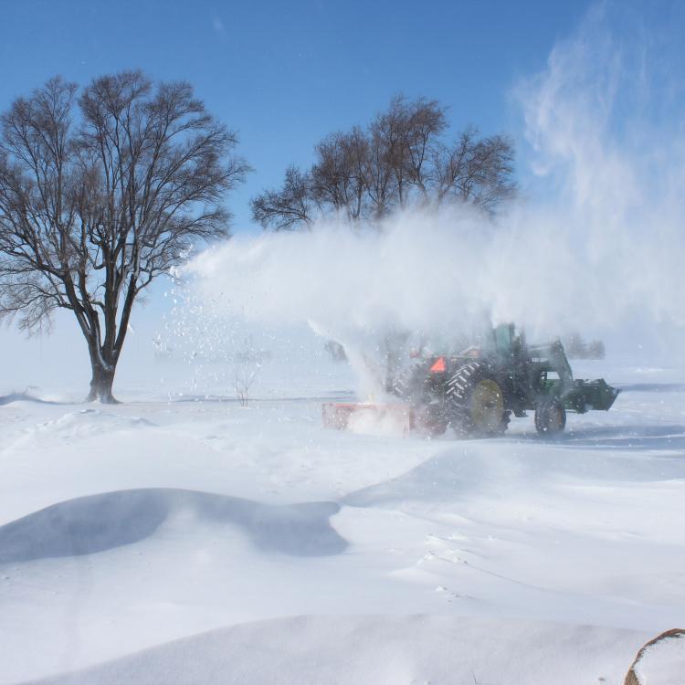 tractor blowing snow