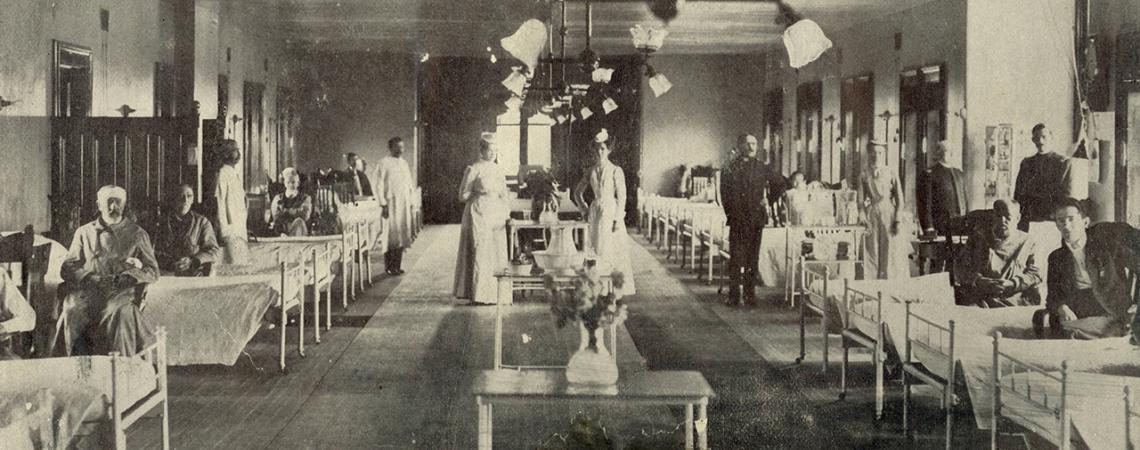 An old black and white picture of the hospital ward.