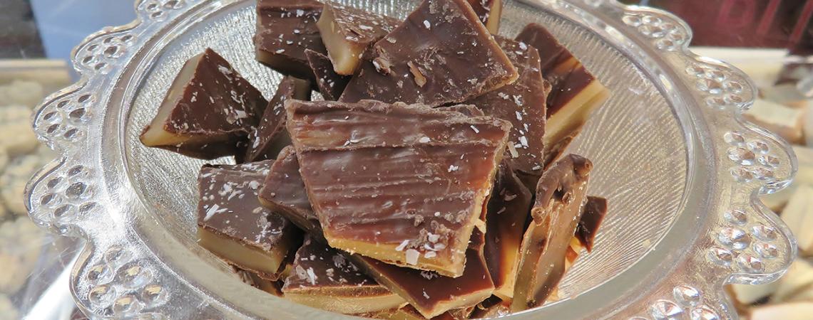 A bowl of peanut brittle.