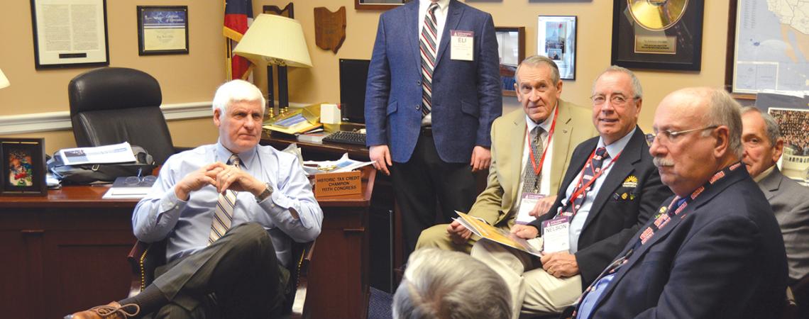Cooperative leaders sit with U.S. Rep. Bob Gibbs