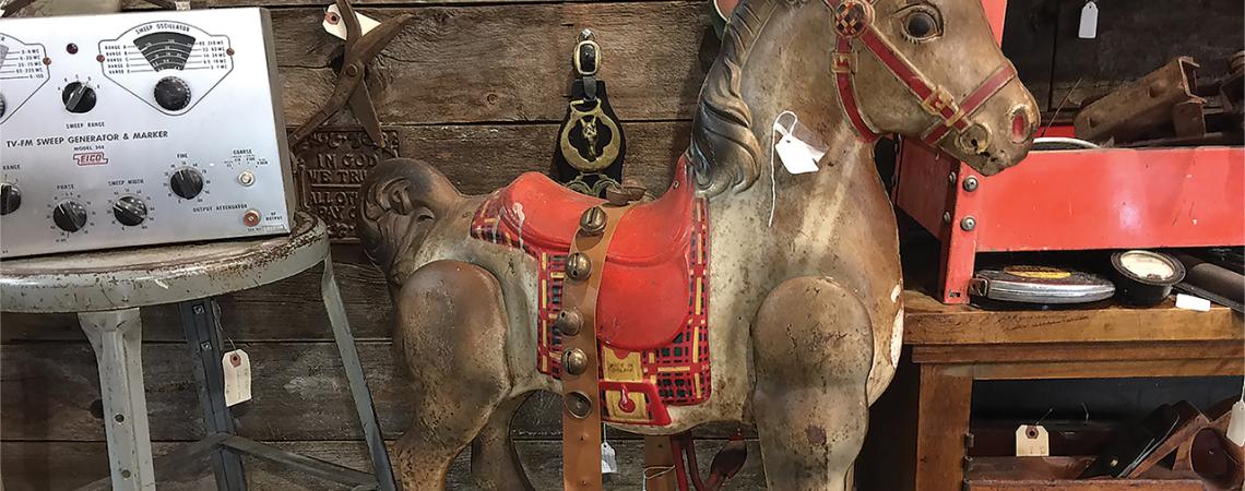 A toy horse sits in a toy store.