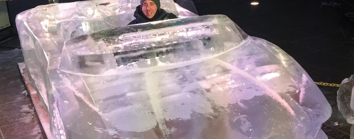 Chad Hartson sits in a 2017 Lamborghini he carved out of ice.