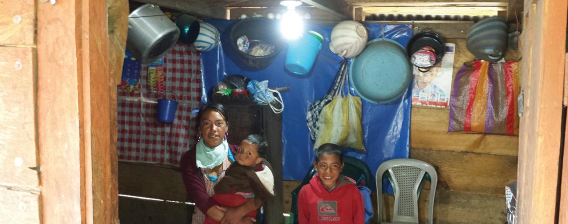 A family in Guatemala poses together for a picture.