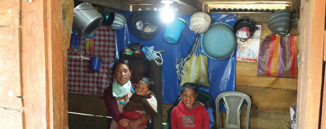 A family in Guatemala poses together for a picture.