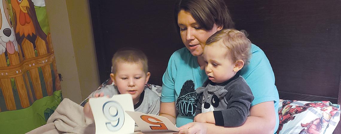 Valerie Williams reads to her children