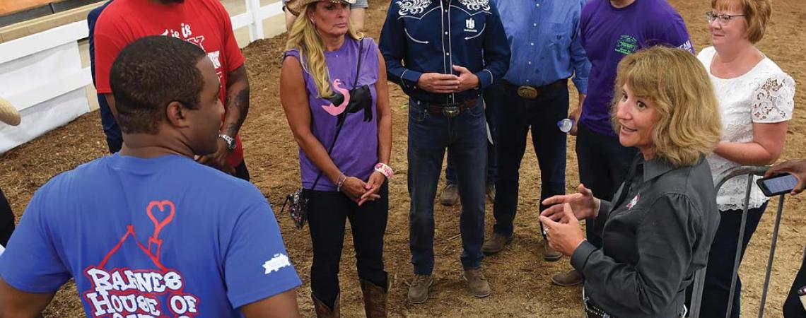 Cathann Kress speaking at cattle show. 