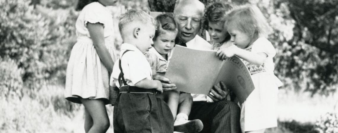 Highlights for Children founder Garry Meyers reads the magazine to his grandchildren.