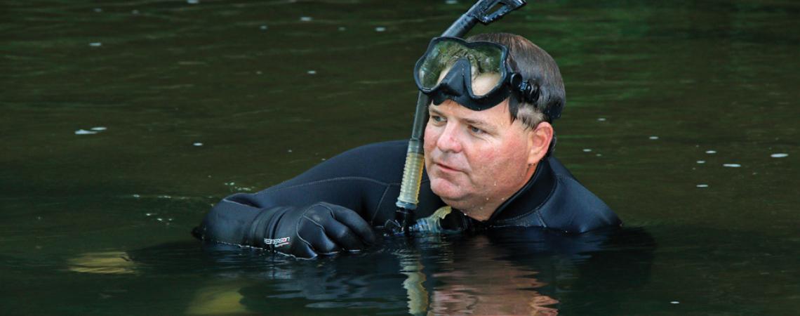 Tricounty Rural Electric Cooperative member Greg Lipps, in his element studying Ohio’s amphibians.