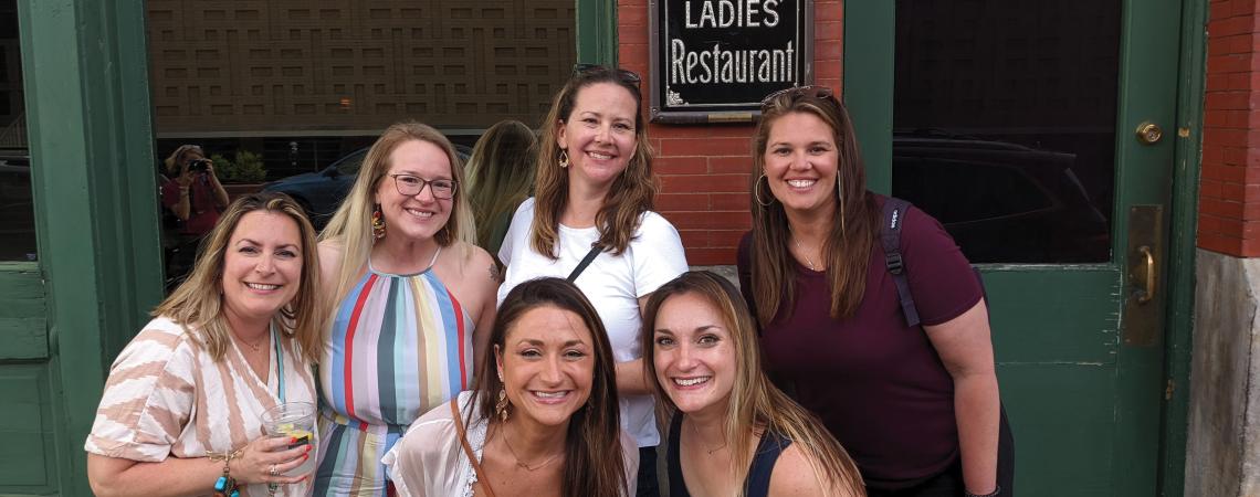 Best friends Katie Helfrich, Kim Fulks, Stephanie Snee, Marella Murphy, Summery Rowlands, and Brittany Buch pose for pictures while embarking on a night out with Canton Food Tours.