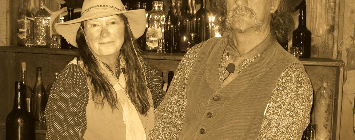 Owners Mike and Sharlene Montgomery stay in character while manning the saloon.   