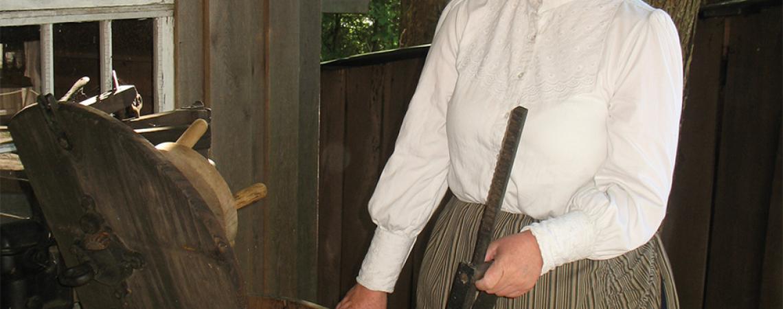 Volunteer Karen Taylor does a load of laundry, Old West style. 