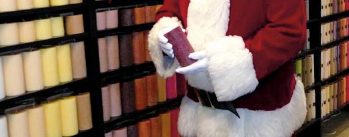 Santa shops for stocking stuffers from among candles in a bevy of sizes and fragrances.