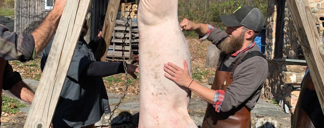 Co-owner Andy Lane of Hand Hewn Farm shows the latest class of would-be butchers the first steps in the process (photo by Margie Wuebker)