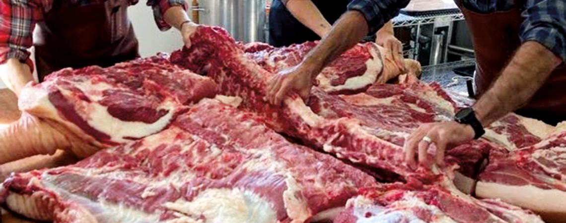 After the initial butchering, students put the parts back together to show where all the parts were cut (photo courtesy of Hand Hewn Farm).