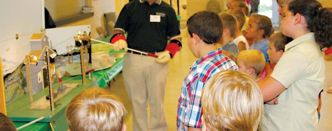 Stacey Shaw teaching students about beekeeping.