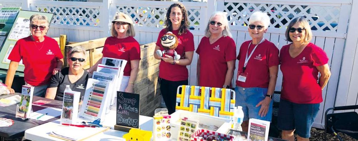 Master gardeners often set up informational booths to share tips and help at community events.