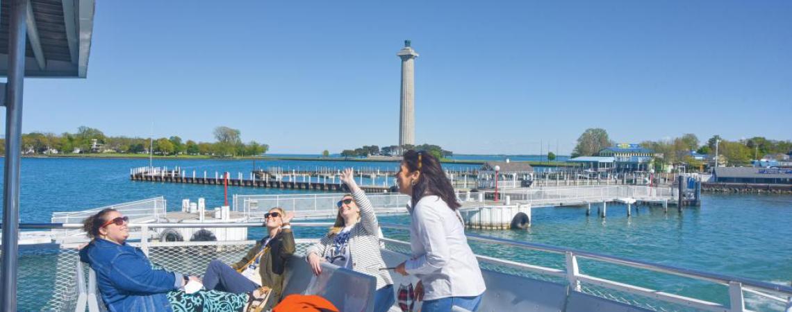 Passengers on the upper deck of a ferry.