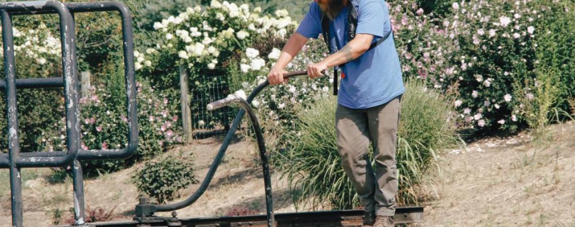 A man using a crank lock on the Muskingum River