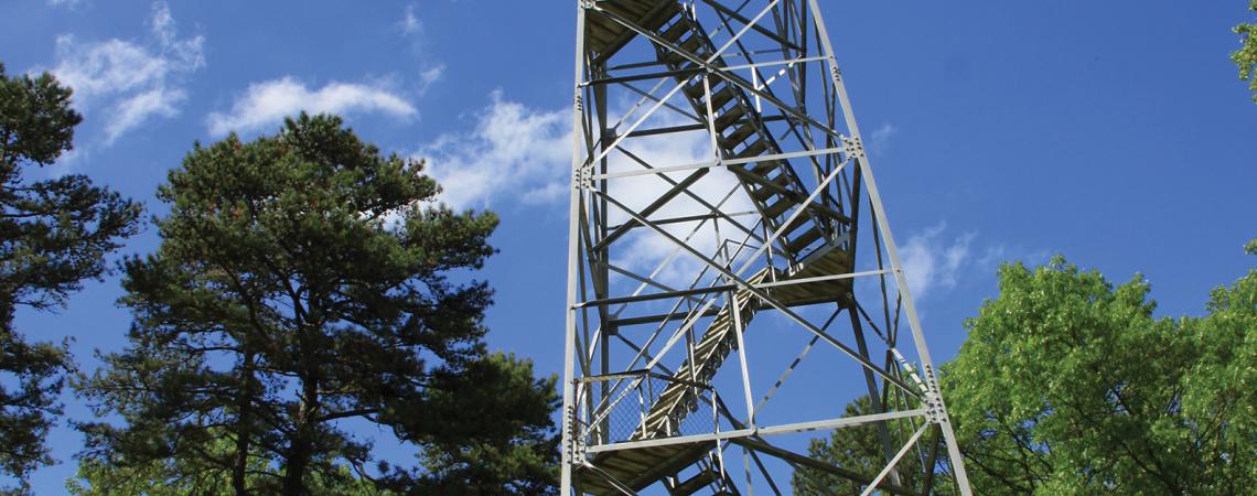 Fire tower against sunny sky