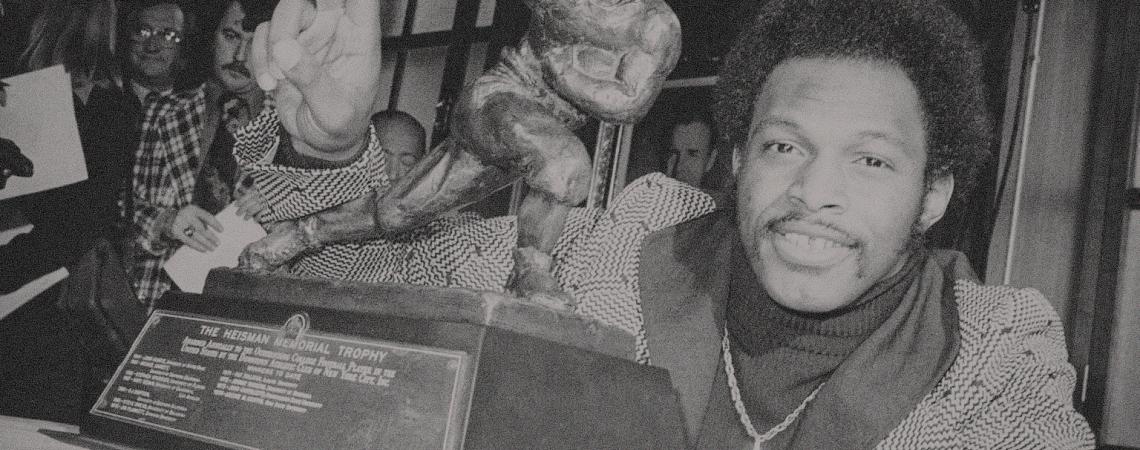 Archie Griffin with his Heisman Trophy