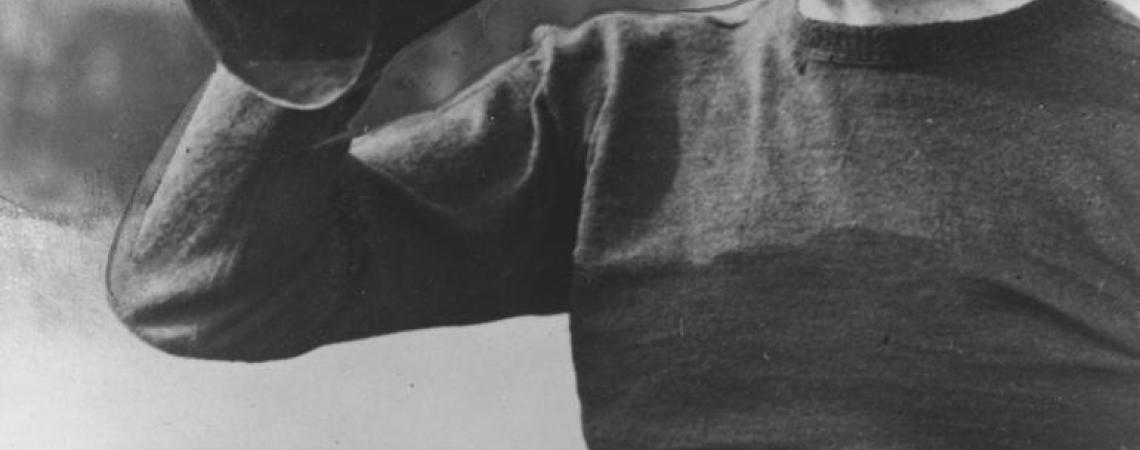 A black and white photo of John W. Heisman