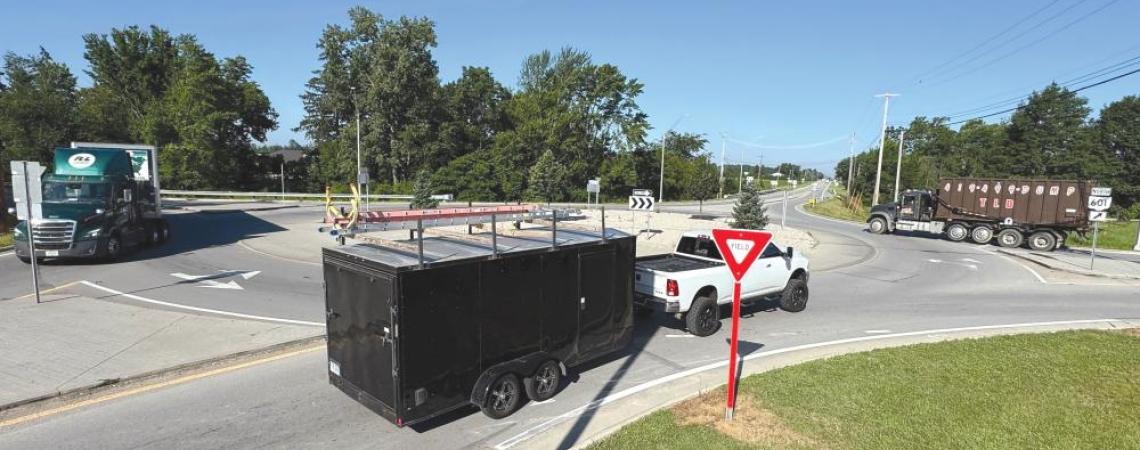 Vehicles driving through a roundabout