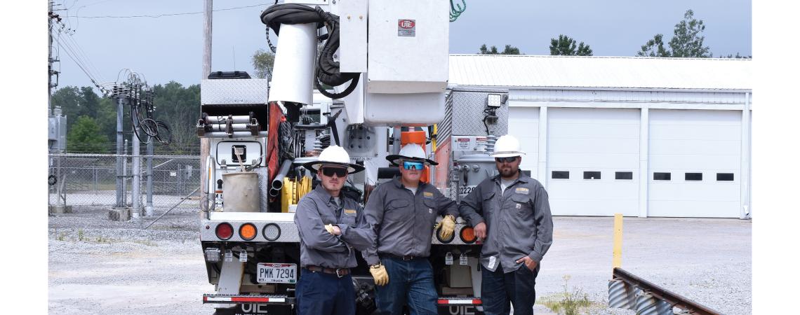 modern electric line crew with truck