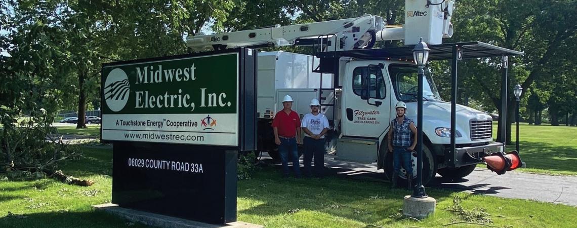 tree-trimmers in front of truck