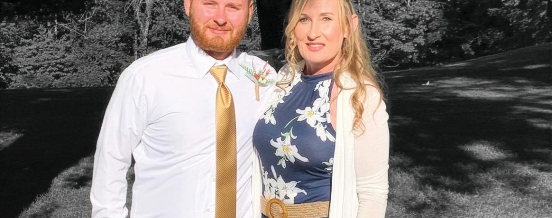 A black and white image of a mother and adult son