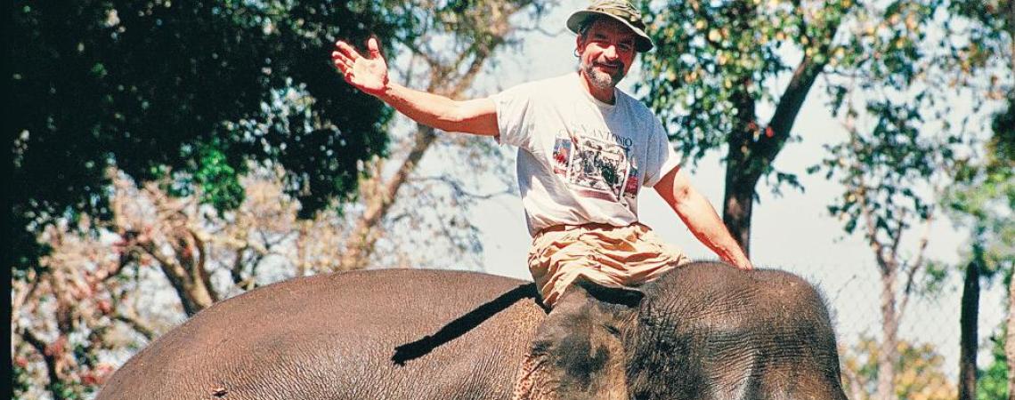 A man sitting on an elephant