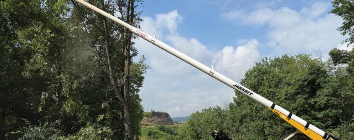A right-of-way crew from The Frontier Power Company uses a Jarraff to cut back trees away from power lines.