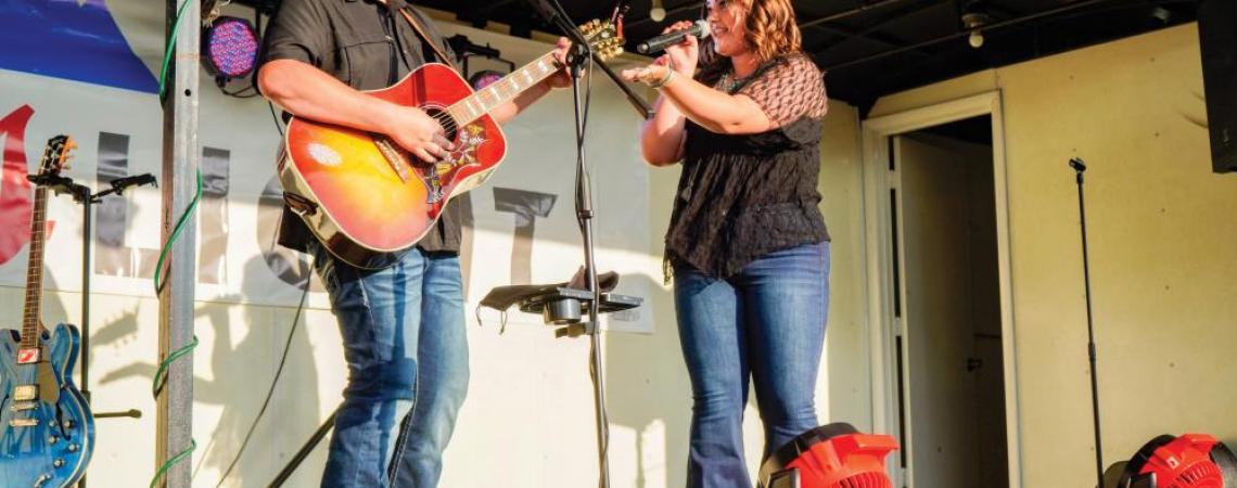 Dalton Hesson and Delaney Moore performing together on stage