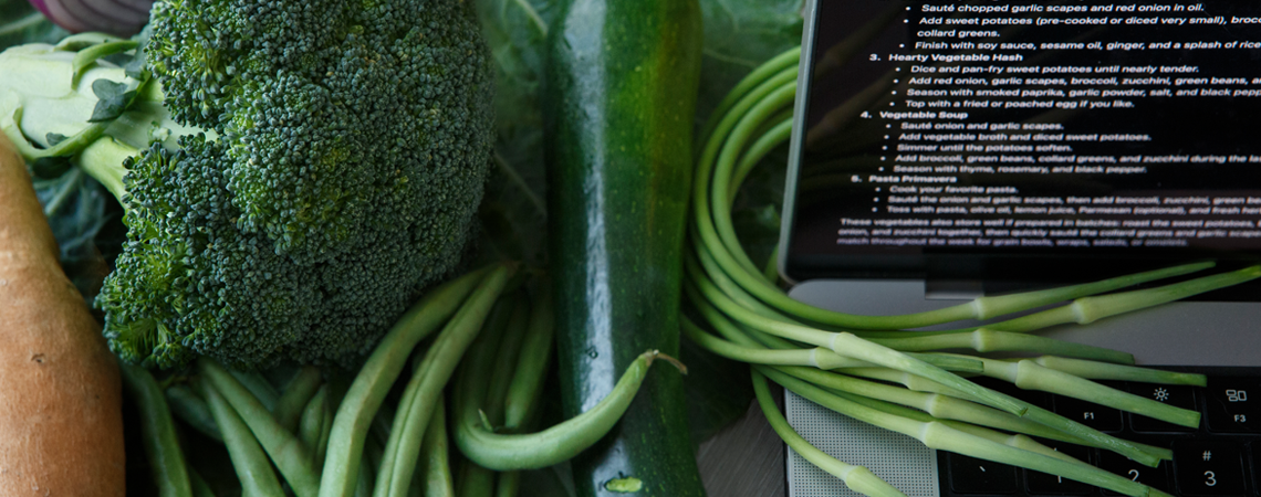 Vegetables beside a laptop