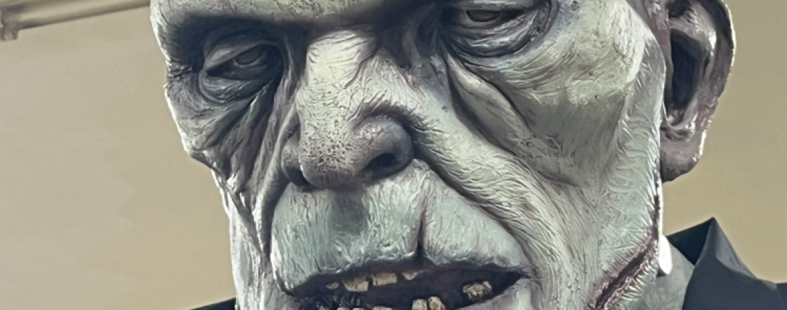 A realistic haunted-attraction sculpture of Frankenstein
