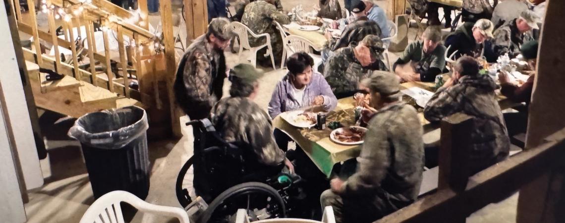 A group of veterans in a barn