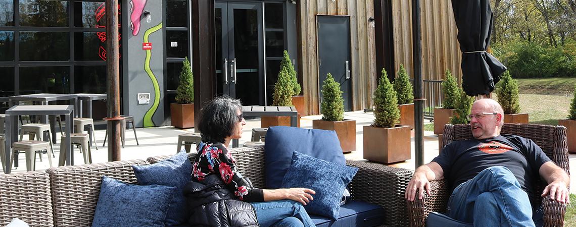 Couple sitting outside BrewDog's Doghouse